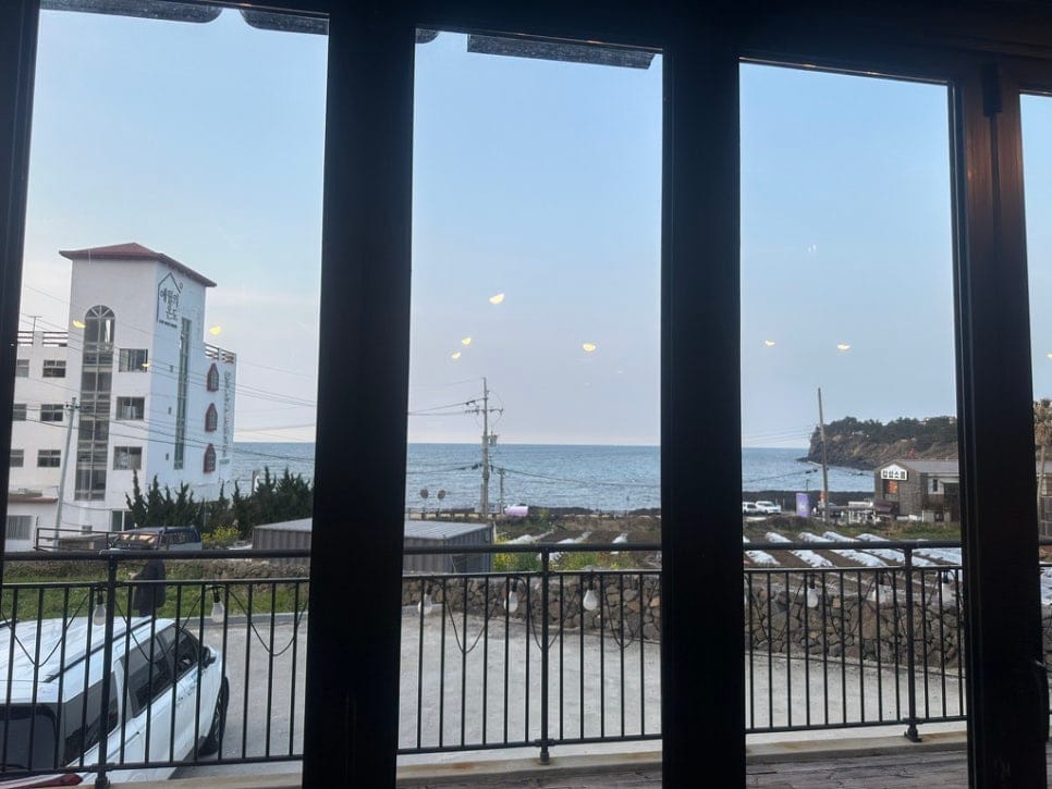 View of the sea and the coastal road through Godokan's windows